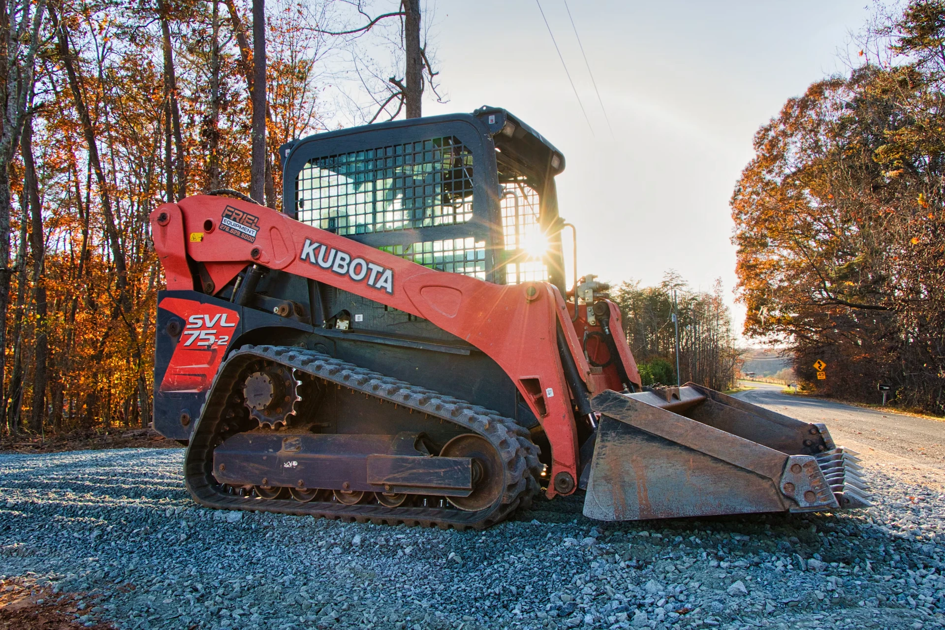Skid steer performing precision grading and finishing work
